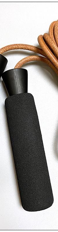 Leather-Grip Speed Jump Rope With Ball-Bearing Spin — in use